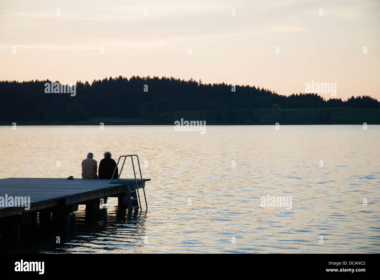 elderly couple by sunset Stock Photo - Alamy
