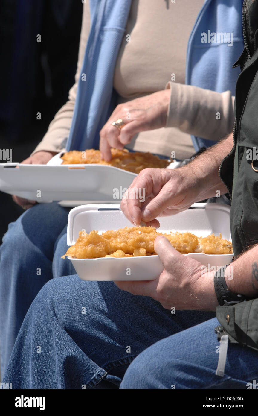 Eating Fish and Chips on the Barbican , Plymouth ,Devon Stock Photo Alamy