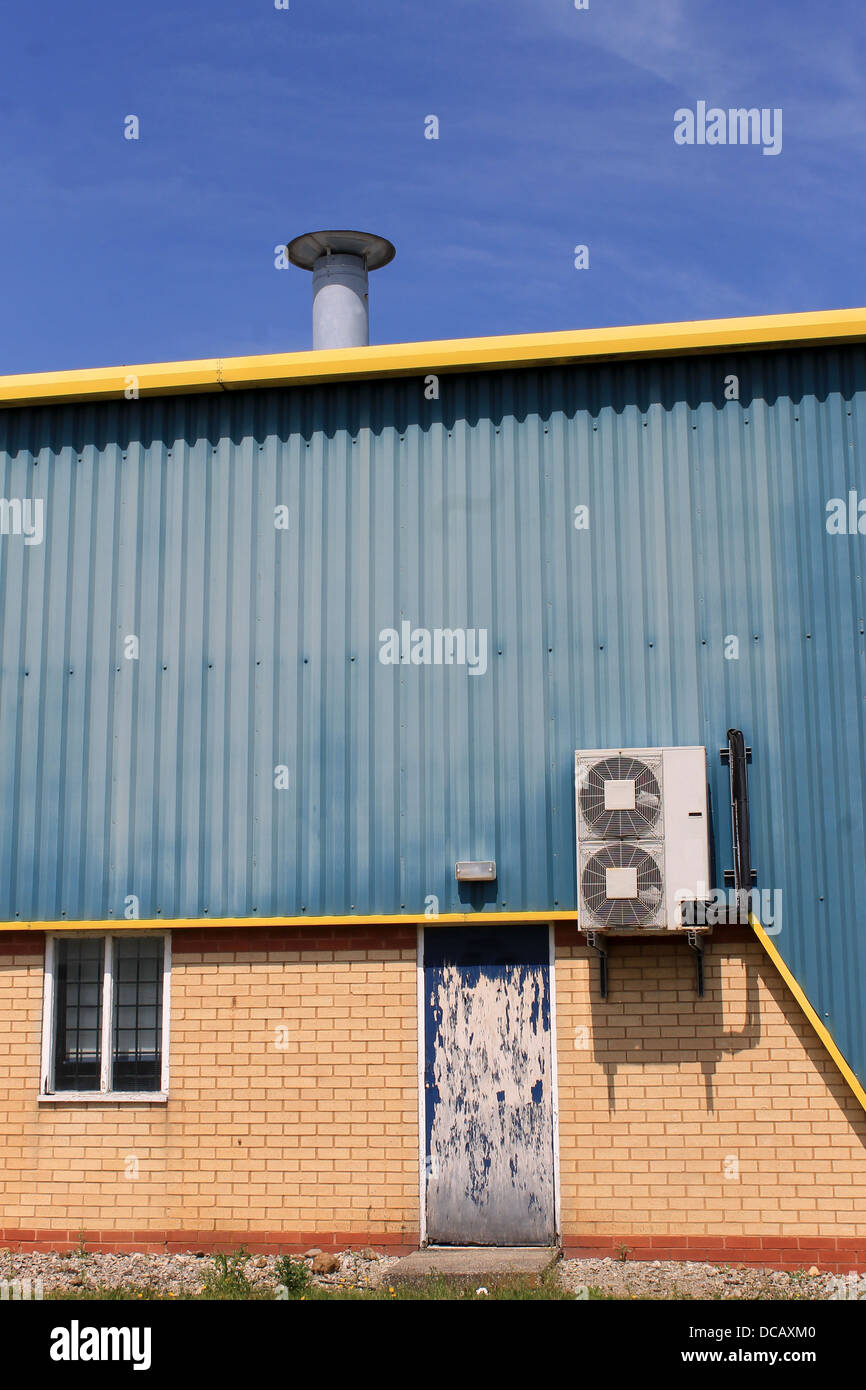 Air conditioing unit on exterior of warehouse building. Stock Photo