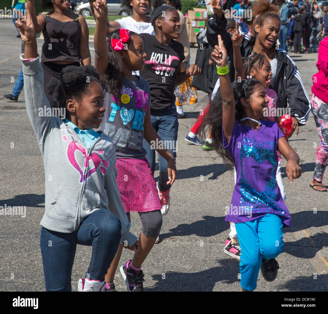 Detroit, Michigan USA. Children dance during an exercise session at a Back to School Festival sponsored by Greater Grace Temple, a 6,000-member Pentecostal church. The annual festival features games, food, health screenings, haircuts, and giveaways of school supplies. Credit:  Jim West/Alamy Live News Stock Photo