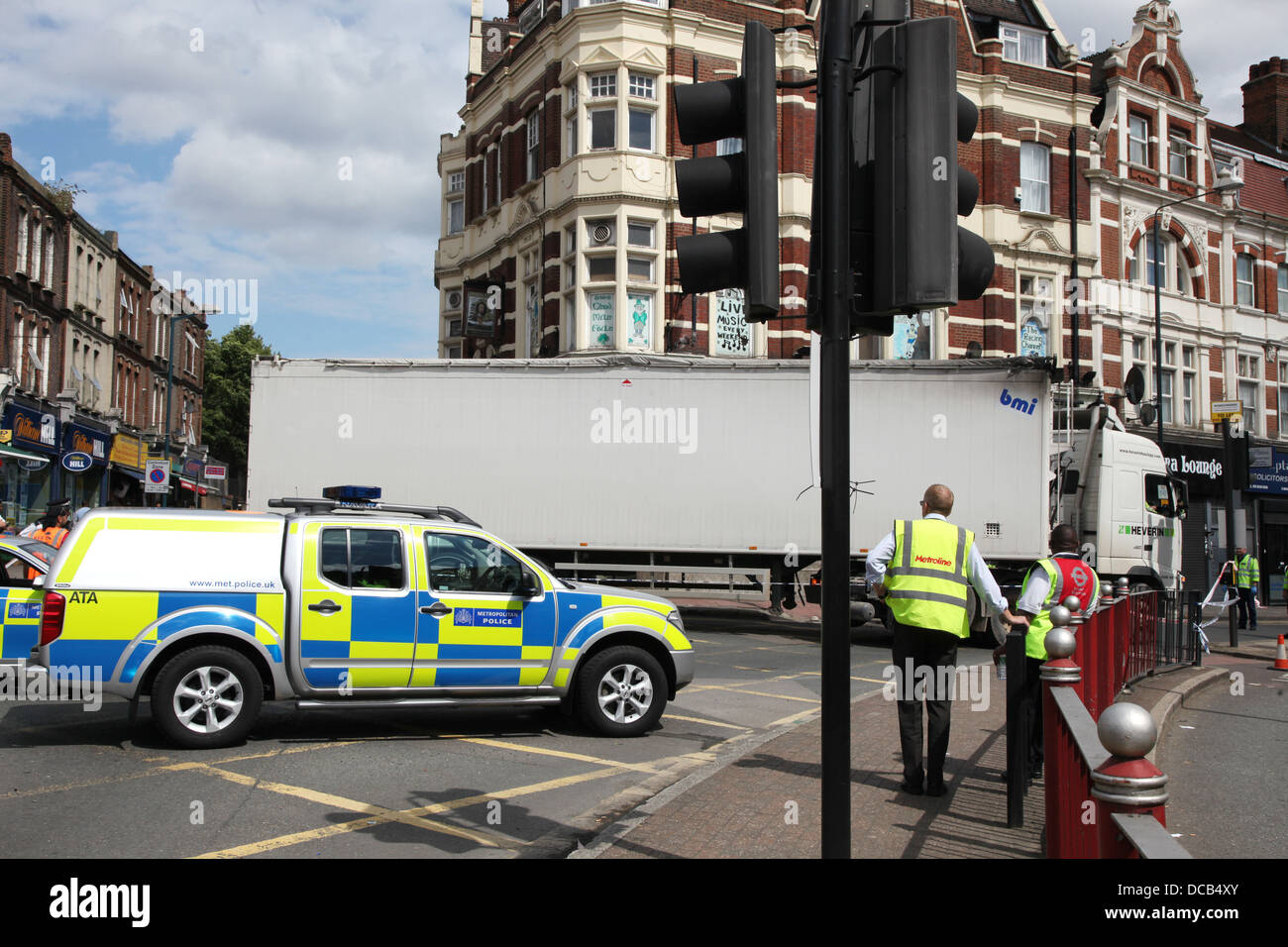 Police and contractors attend to a lorry following a road accident Stock Photo