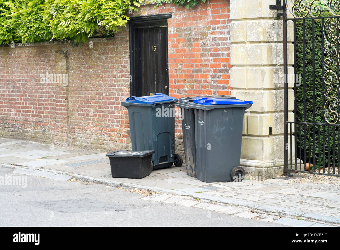 UK recycling wheelie bins on pavement sidewalk awaiting collection Stock Photo Alamy