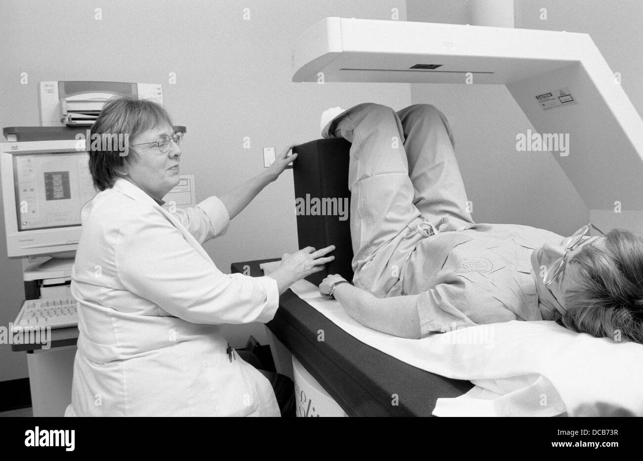 Female doctor examining patient Black and White Stock Photos & Images ...
