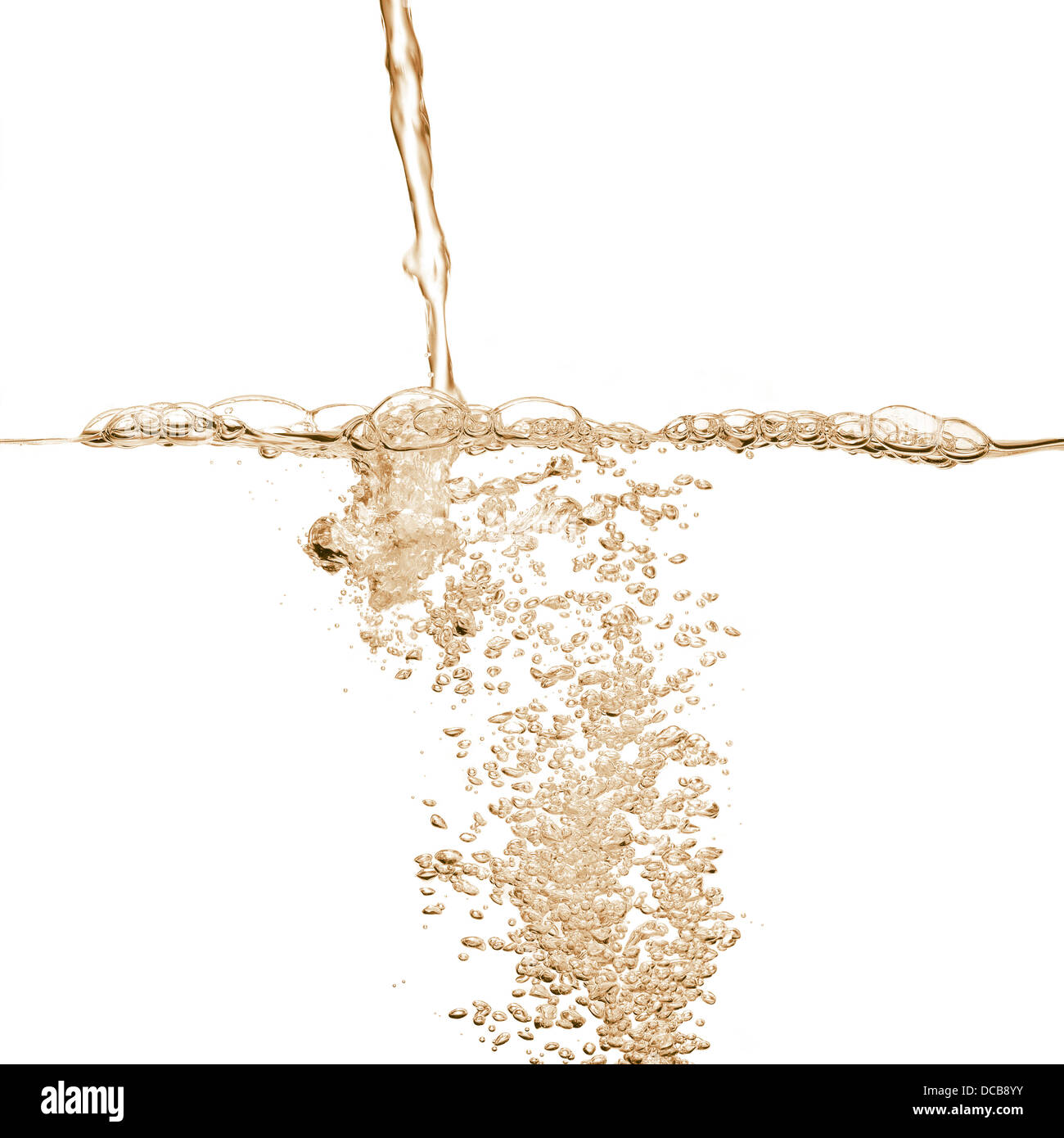 Gold drink splashing and bubbles Stock Photo