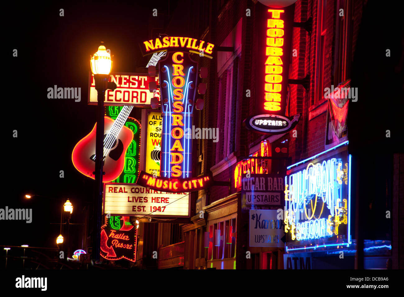 Neon bar signs at night on Main Street in Nashville Tennessee Stock Photo