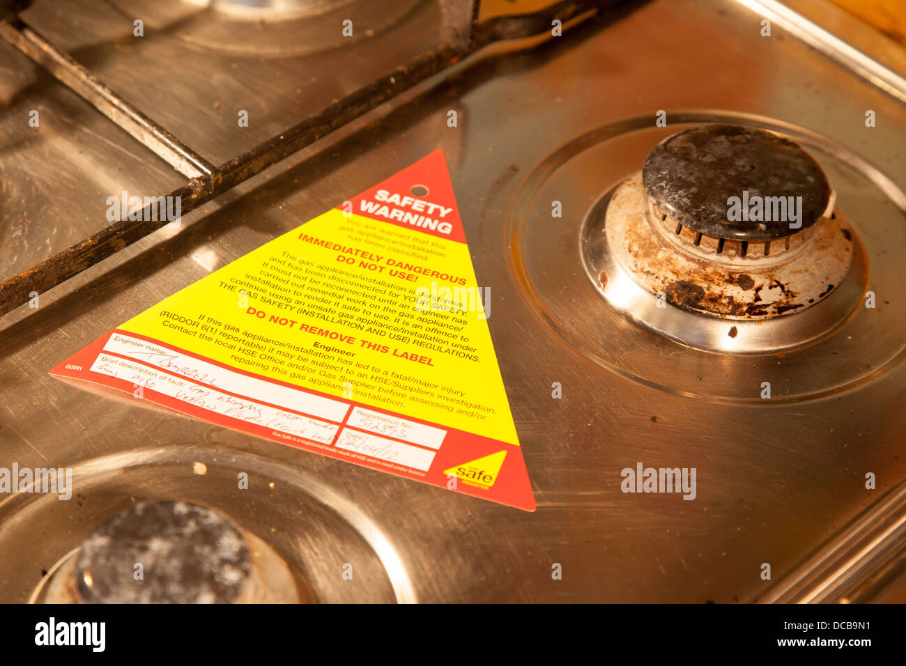 Condemned burners on gas cooker Stock Photo Alamy