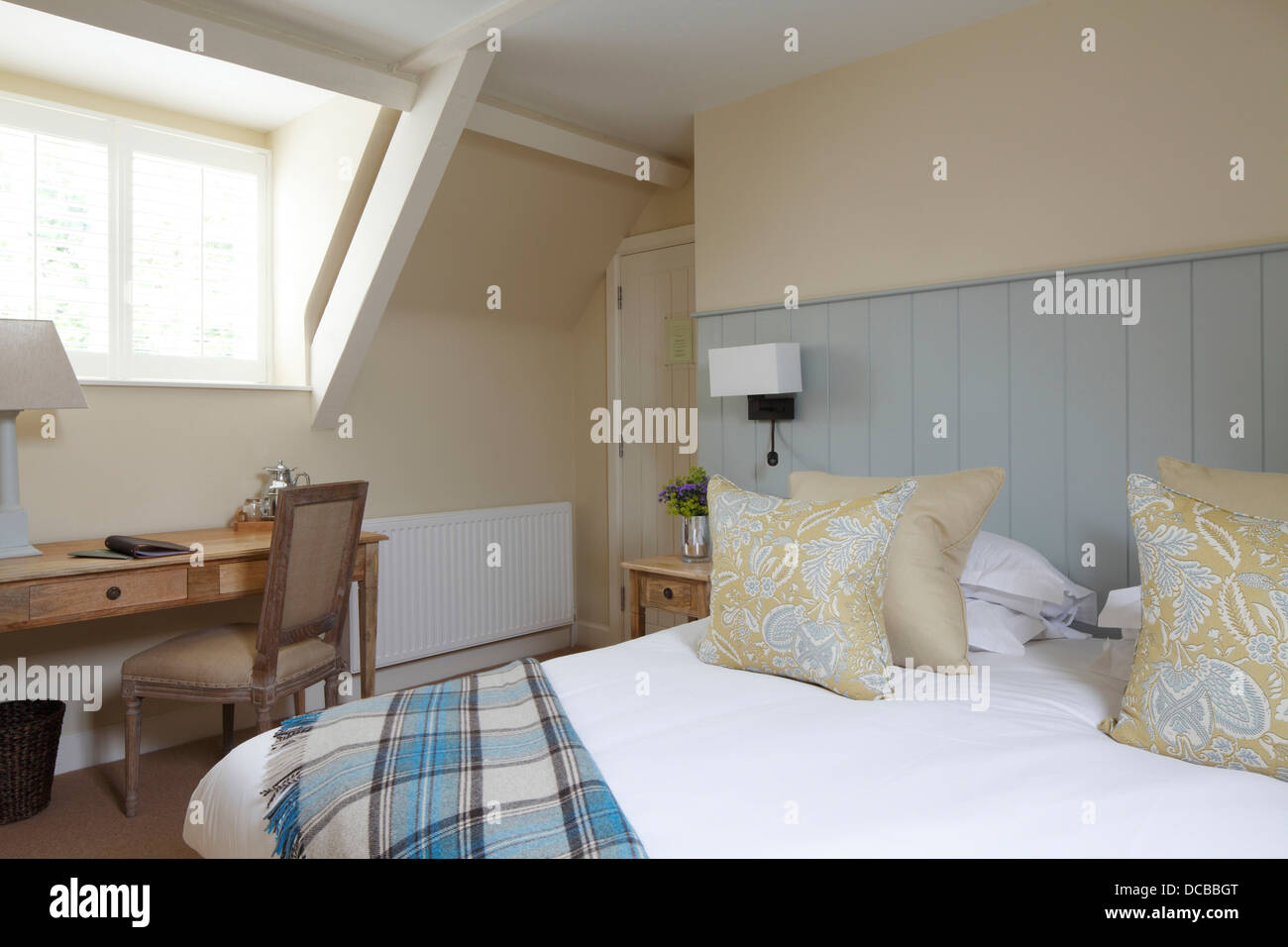 Bedroom with blue tongue and groove headboard, Barnsley, UK Stock Photo