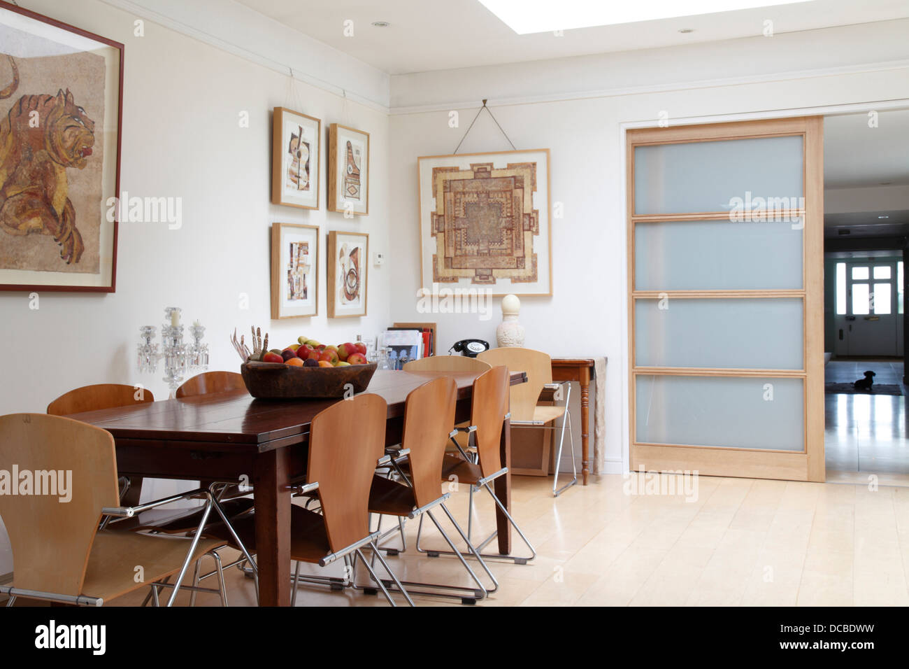 Dining Area With Sliding Door Open Revealing View Through