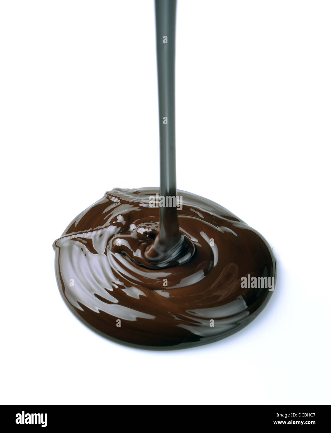 Chocolate flow isolated on white background Stock Photo