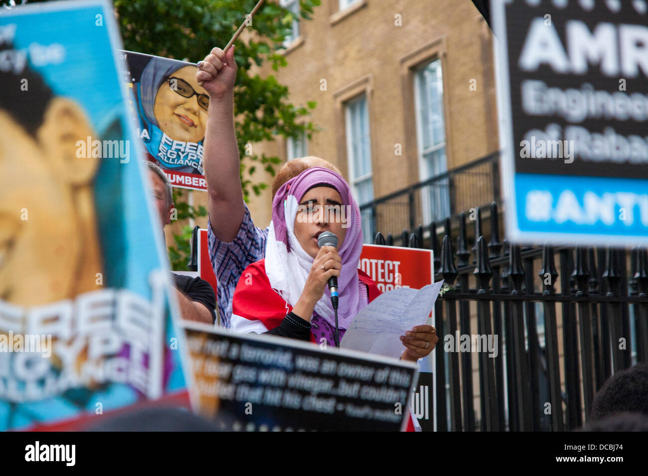 London, 08-14-2013, A woman addresses the crowd as Egyptians protest outside Downing Street following what they say has been massacres of Muslim Brotherhood supporters, leaving 'over 2,000' dead, as protest camps around the country were cleared by the military. Credit:  Paul Davey/Alamy Live News Stock Photo