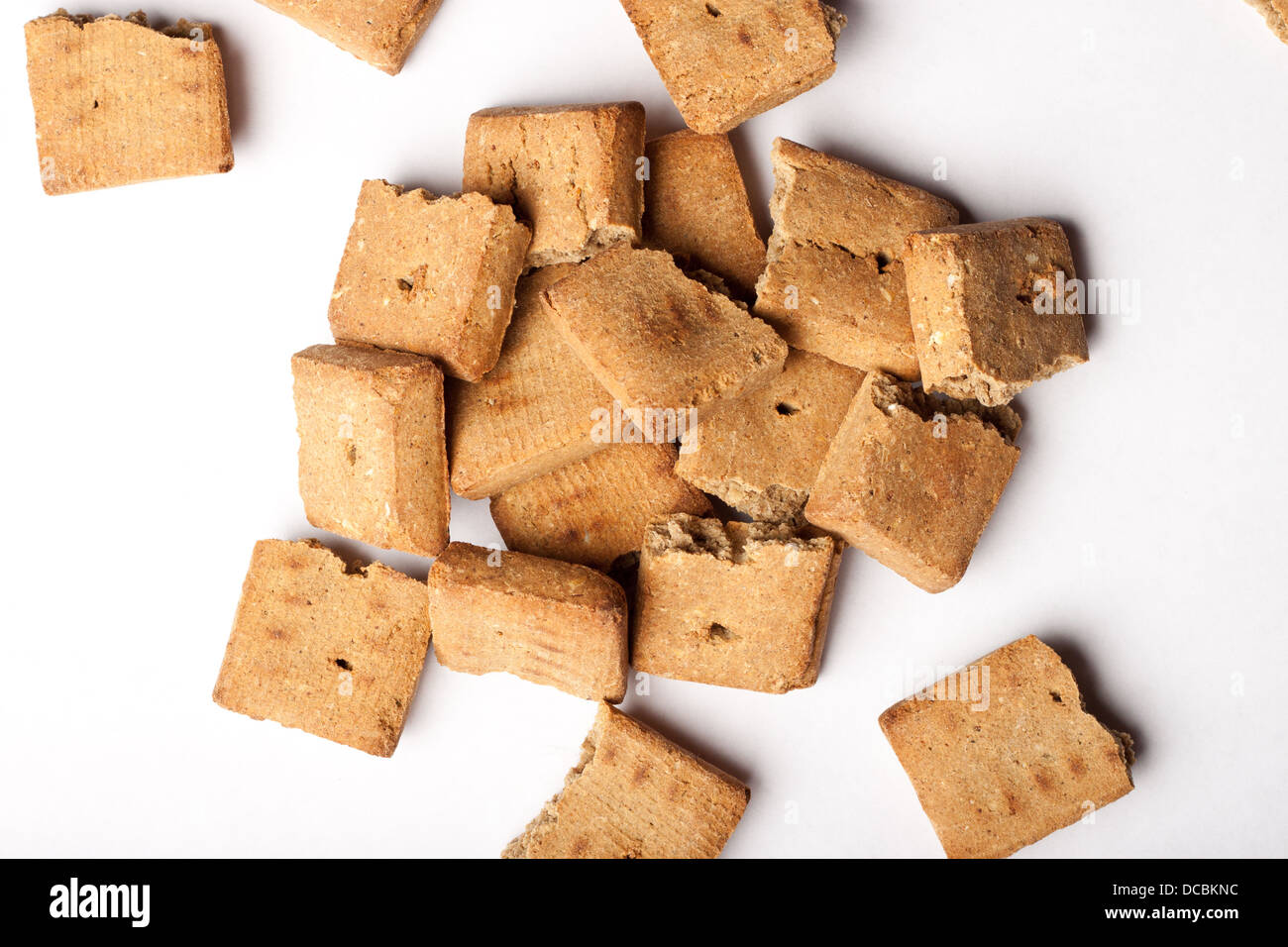 Pile of dog treats against a white background Stock Photo