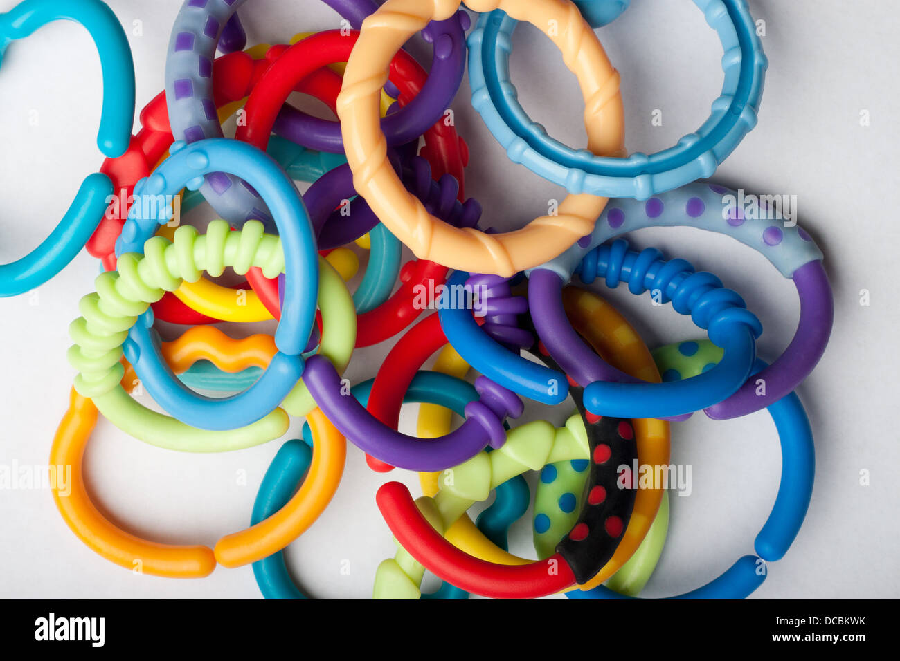 Pile of baby links on white surface Stock Photo