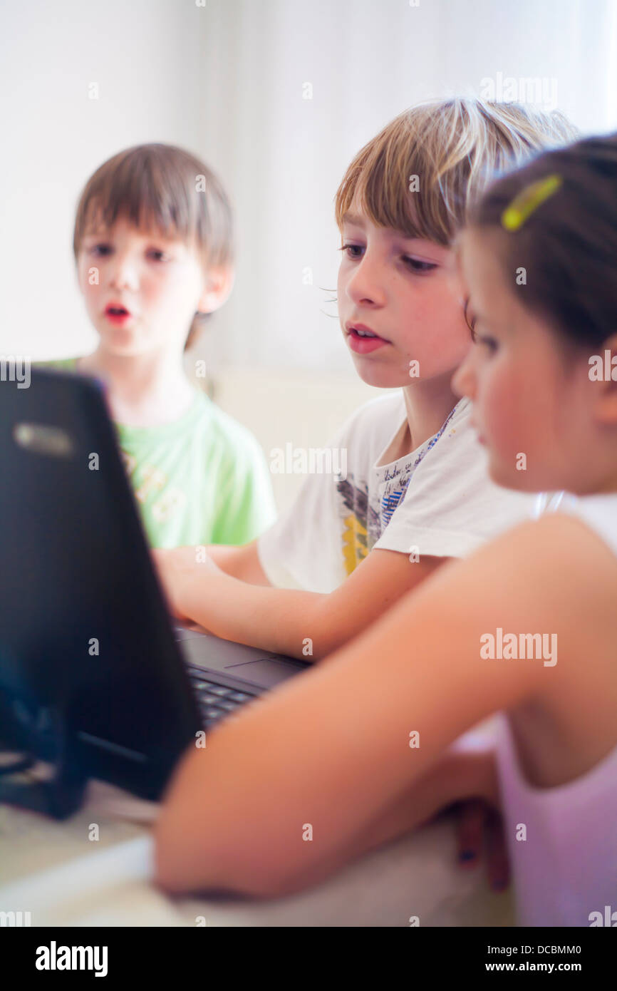 Children watching laptop. Stock Photo