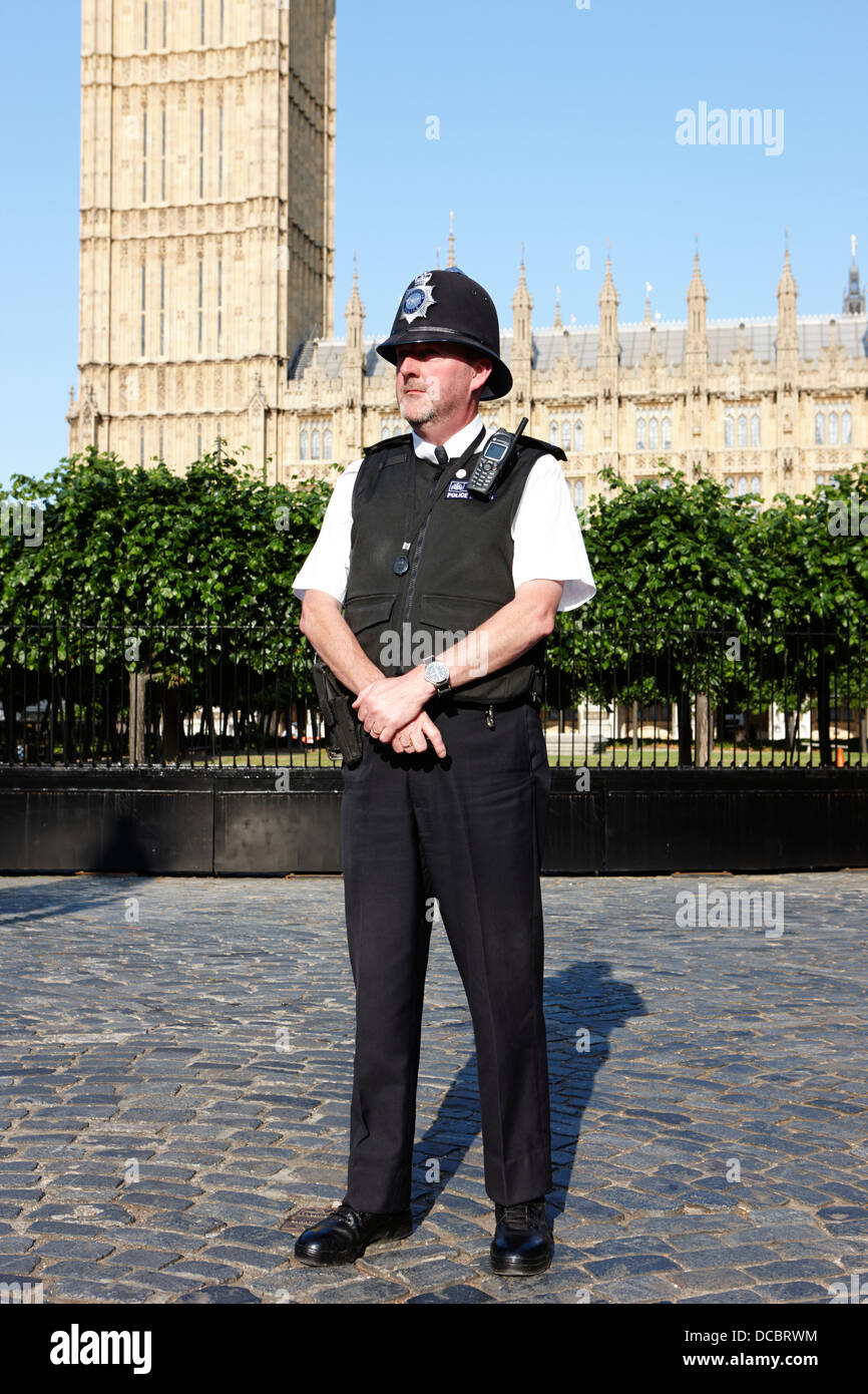 british metropolitan police office guarding the houses of parliament London England UK Stock Photo
