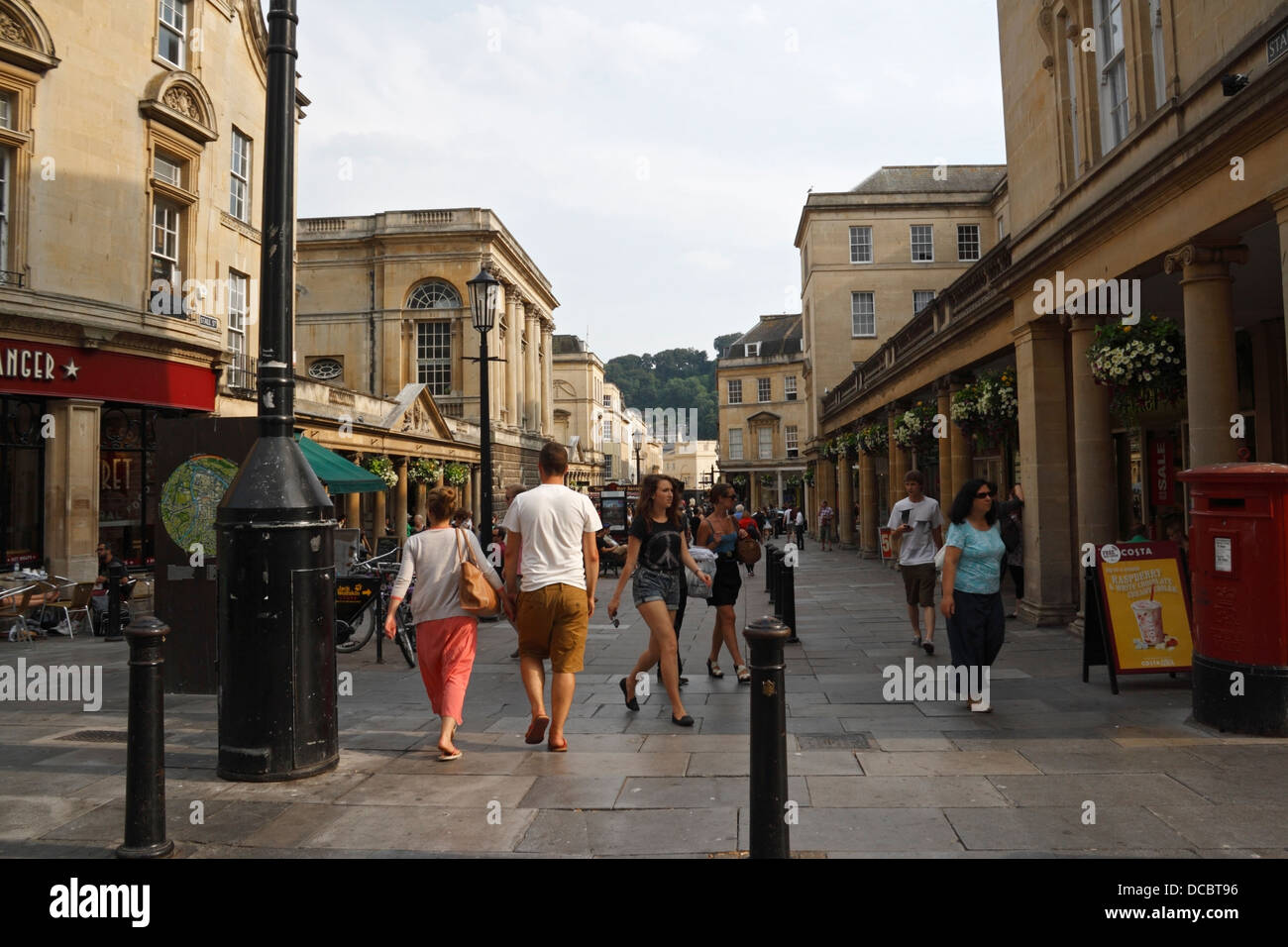 Shoppers Tourists walking in Bath city centre, England UK, English town centre streetscene Stock Photo