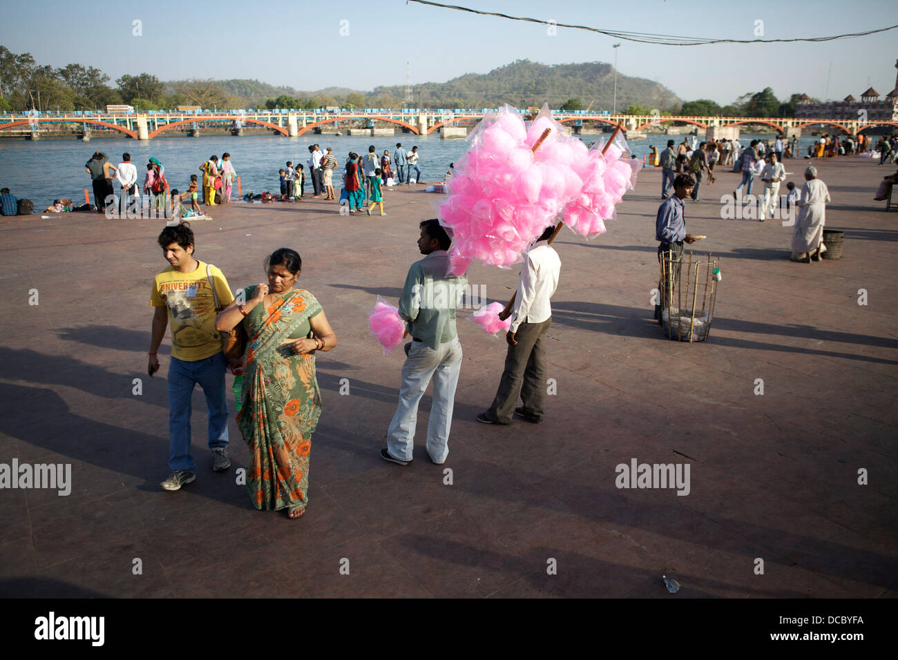 Candy floss sellers try to tout their wares on the banks of the River