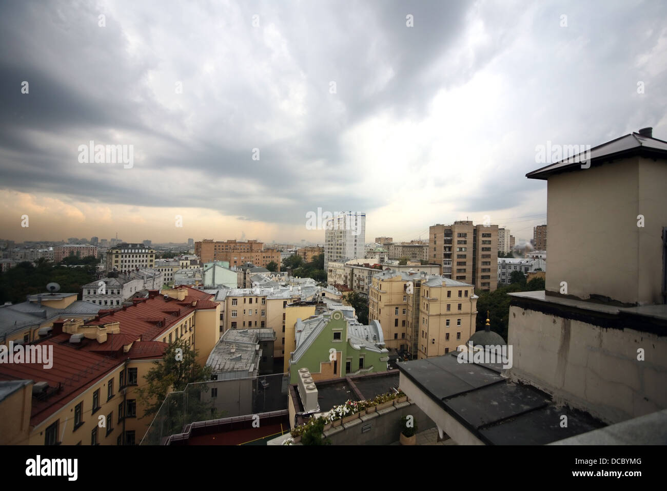 Storm clouds above roofs hi-res stock photography and images - Alamy