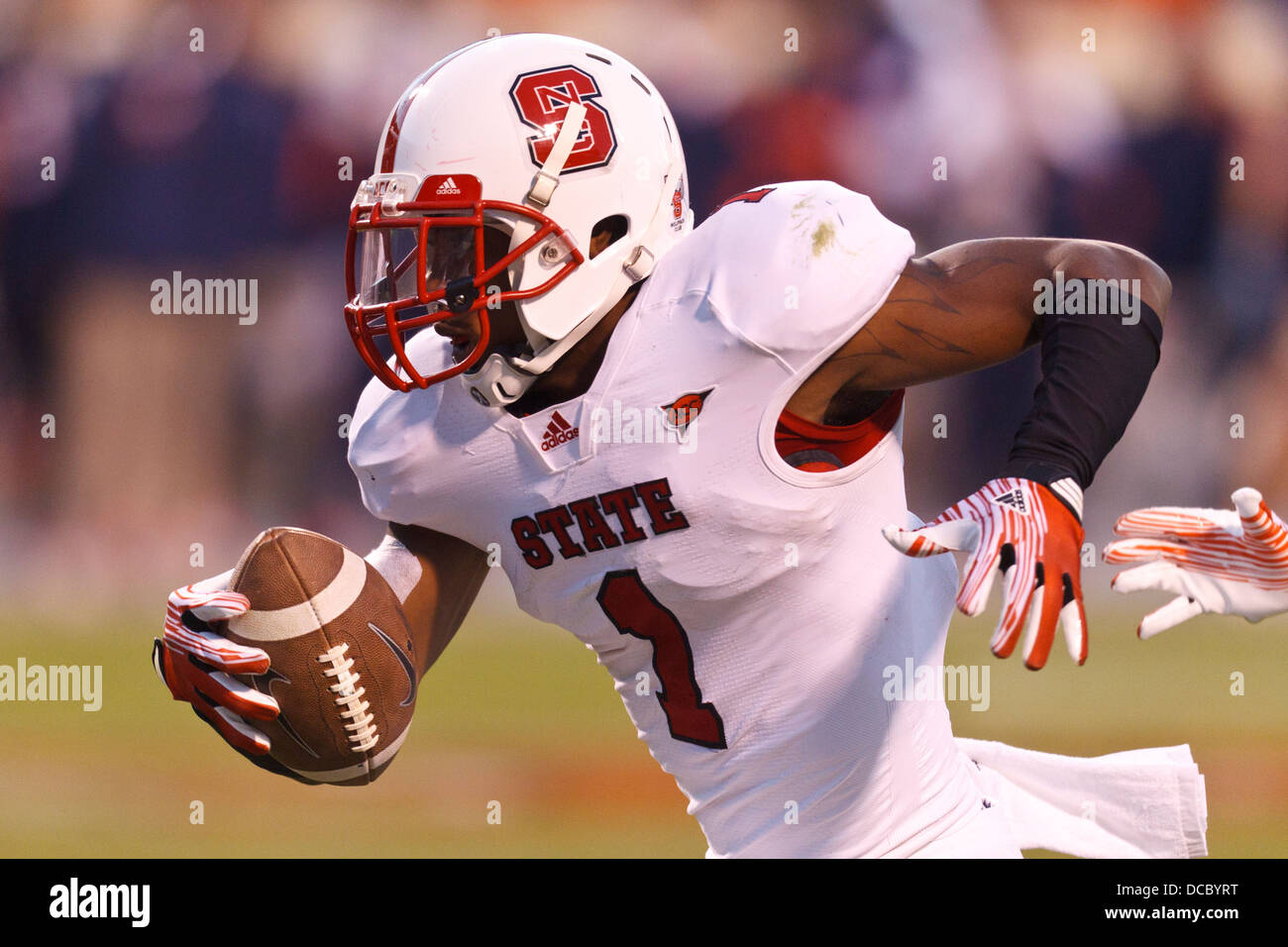 North Carolina State Wolfpack cornerback David Amerson (1) returns an interception for a touchdown against the Virginia Cavalier Stock Photo