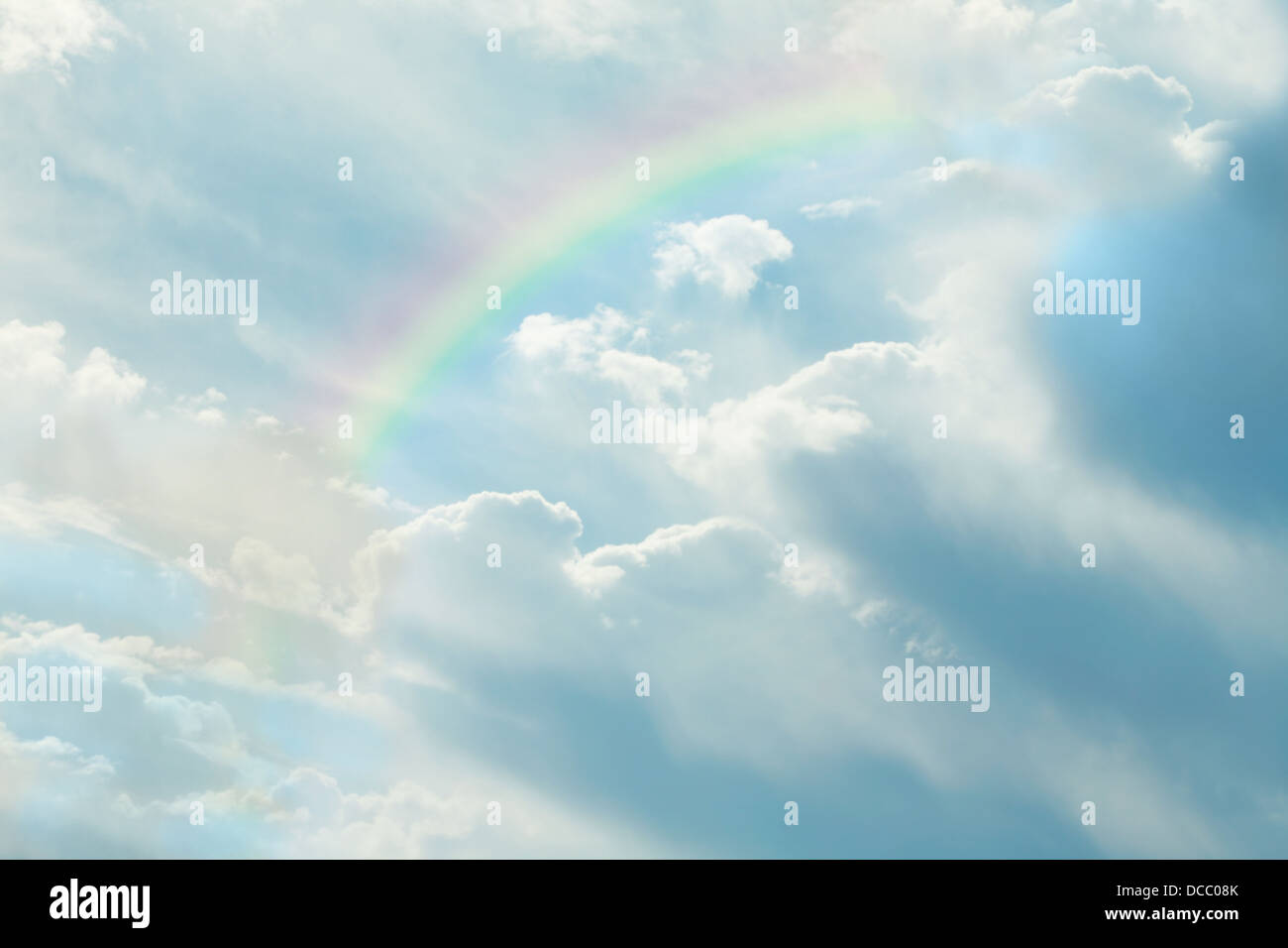 Beautiful clouds in blue sky with rainbow Stock Photo - Alamy