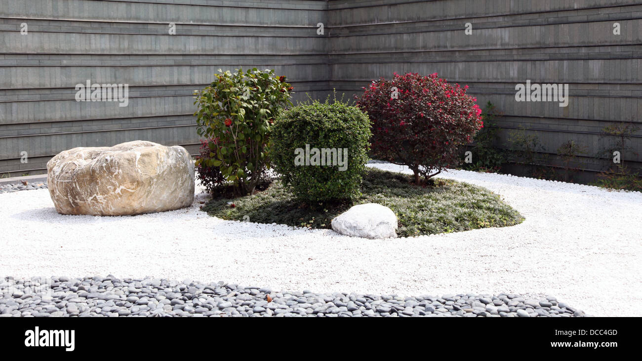 It's a photo of a zen Japanese garden. We can see stones, Stock Photo
