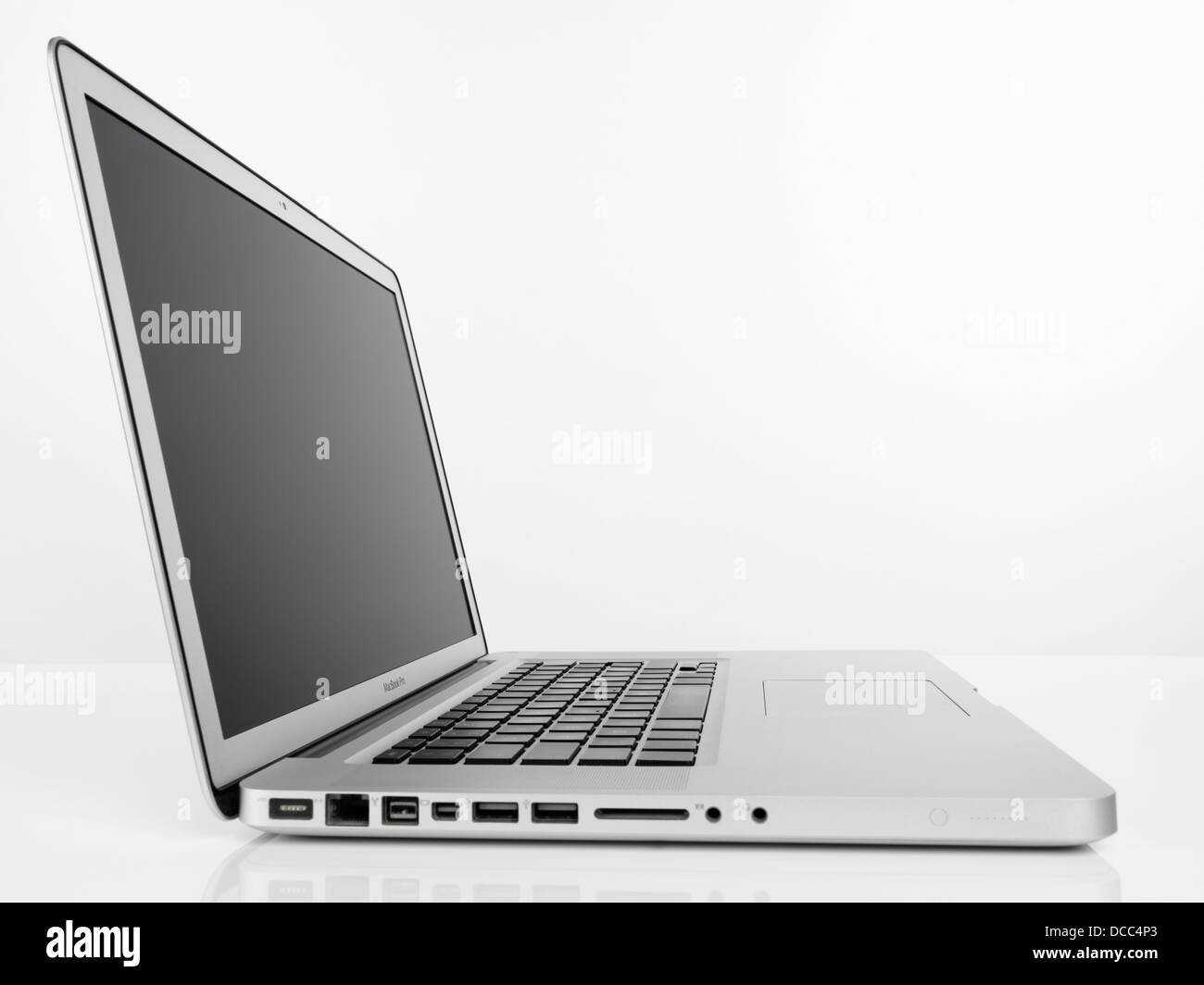 Apple Macbook Pro laptop computer side view isolated on white background Stock Photo