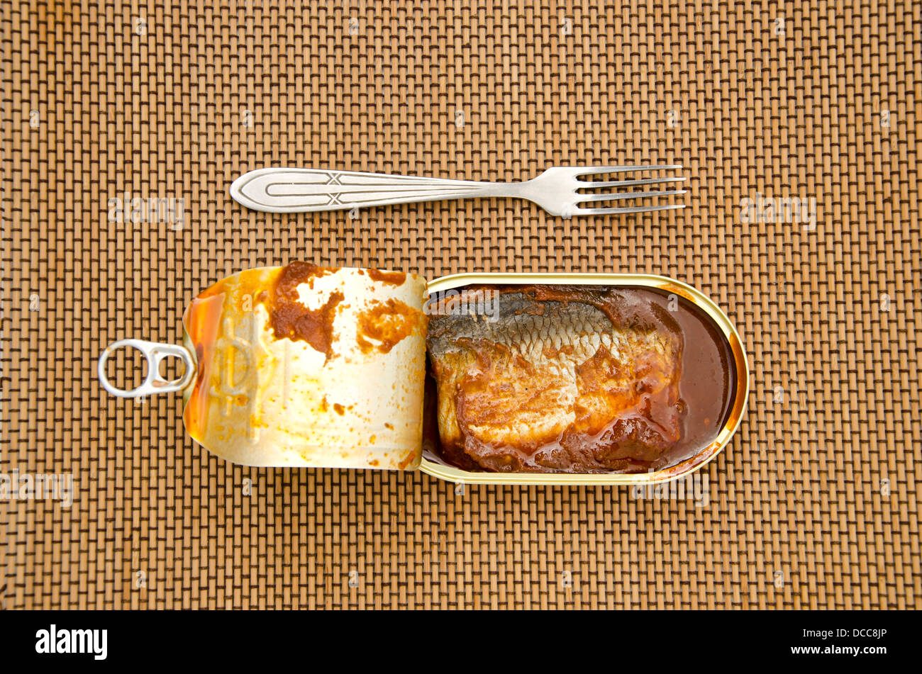 open canned fish with tomato sauce in metal can and fork Stock Photo Alamy