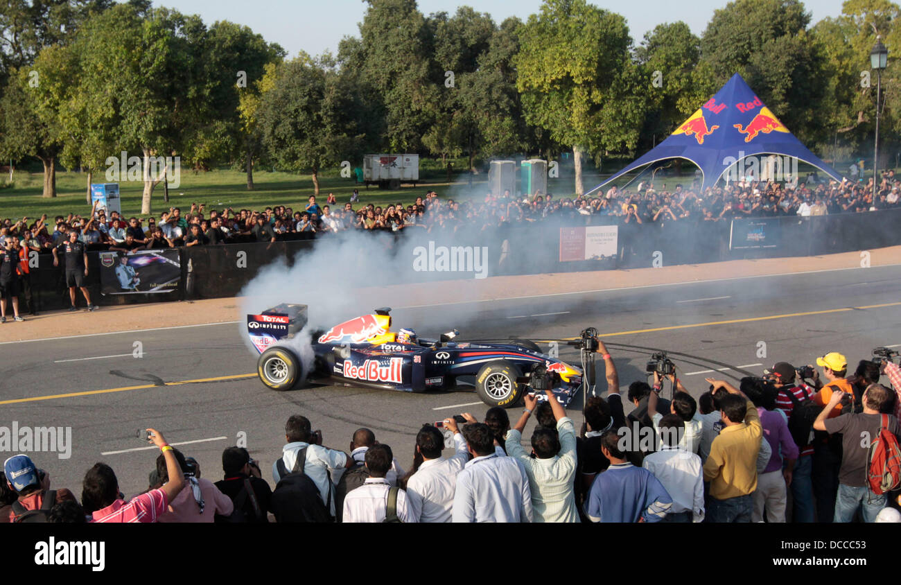 Formula One racer Daniel Ricciardo of Australia drives on Delhi's