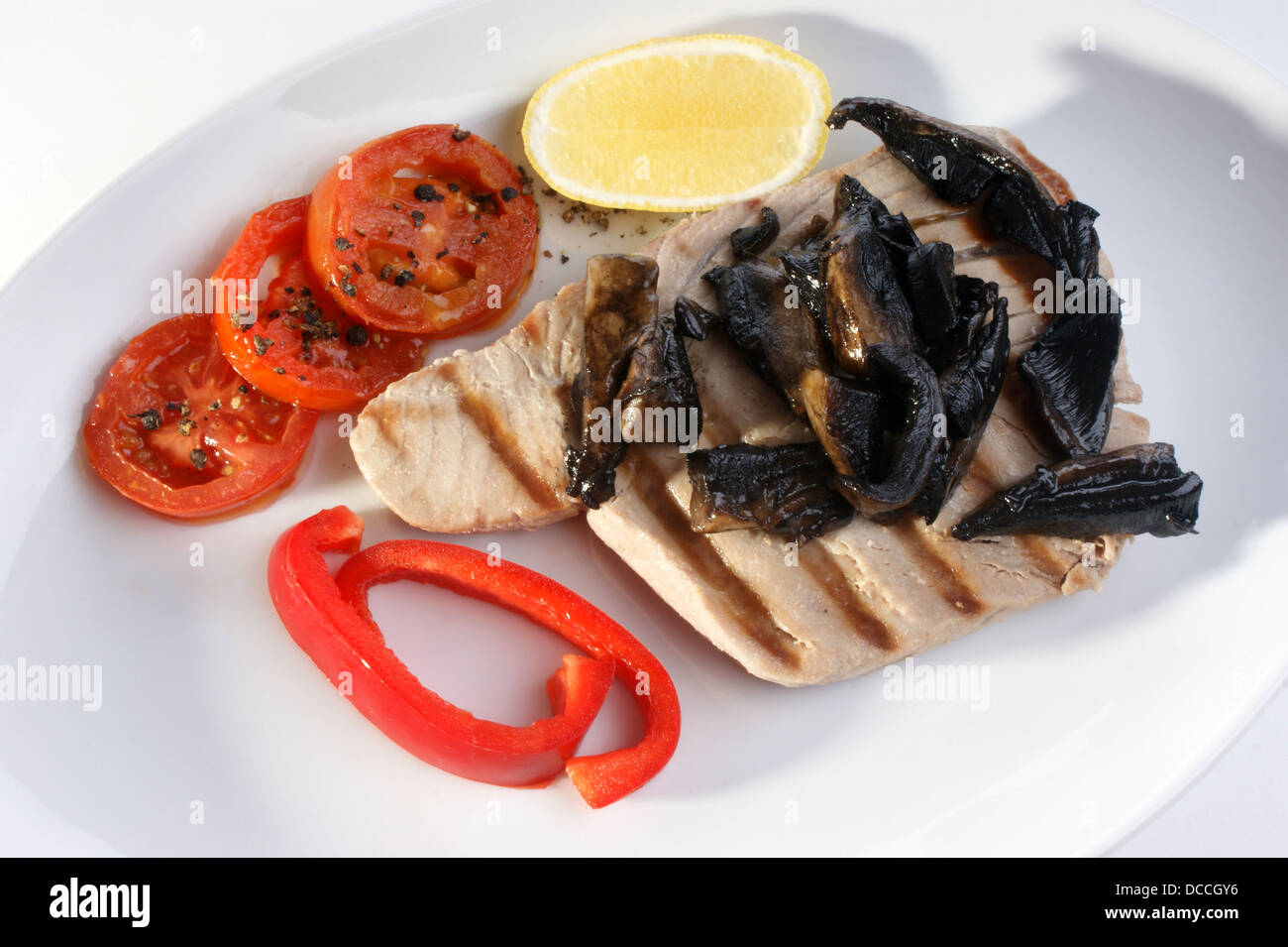 tuna steak with red paprika and tomato Stock Photo Alamy