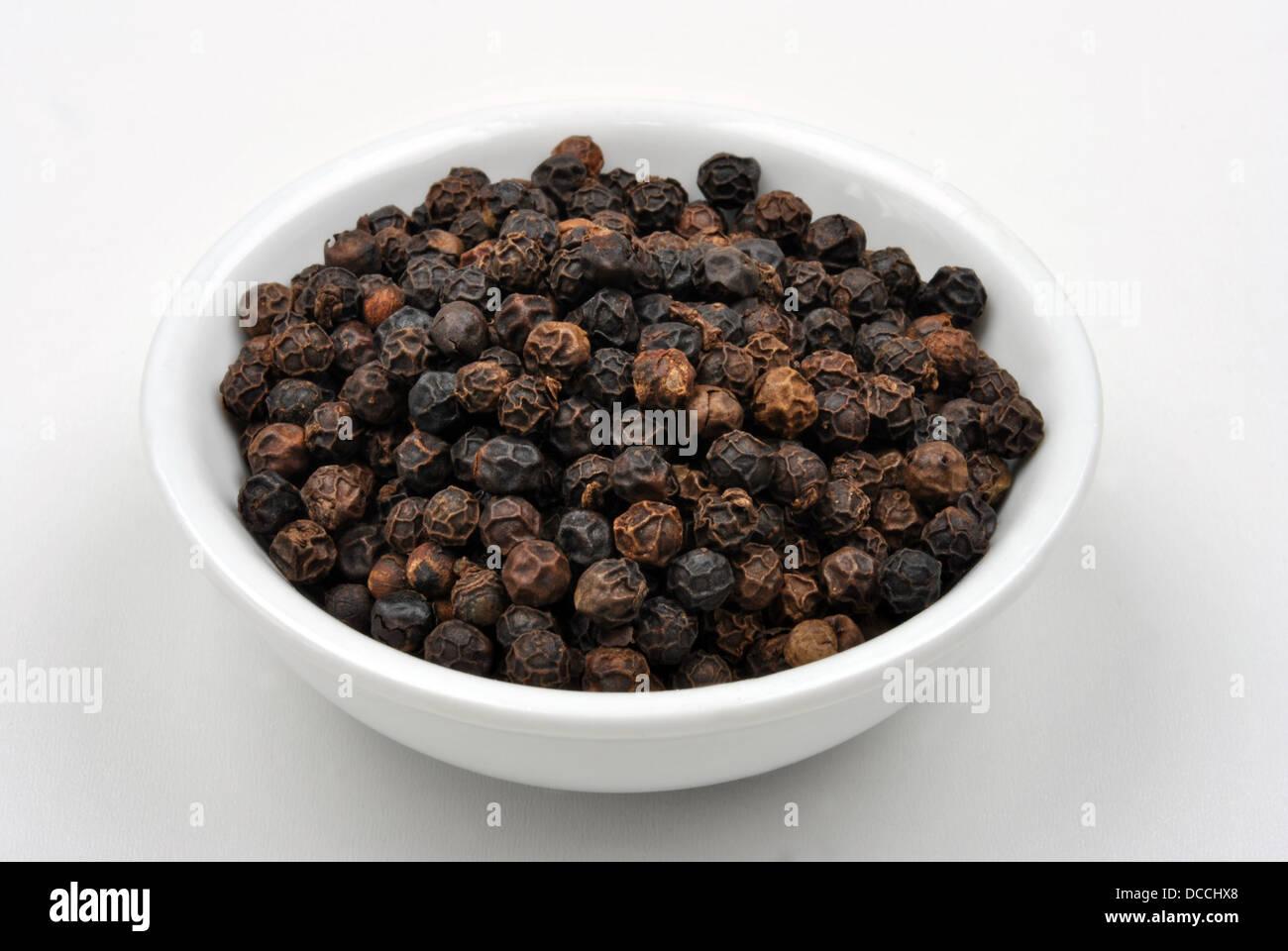 whole organic black pepper is a traditional spice Stock Photo Alamy