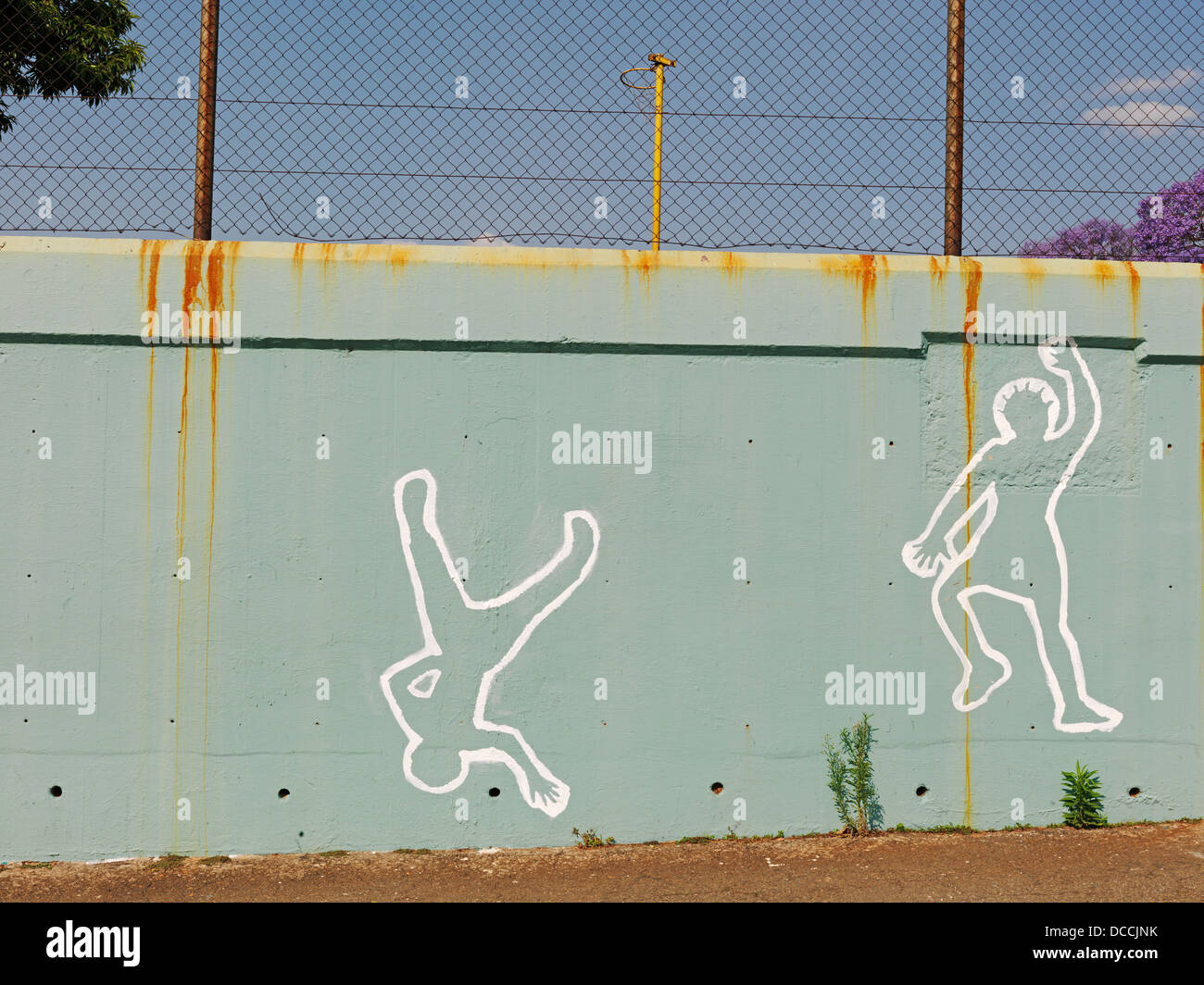 South Africa, Johannesburg, 2010. A mural on a school wall. The figure is reaching as if playing netball. Stock Photo