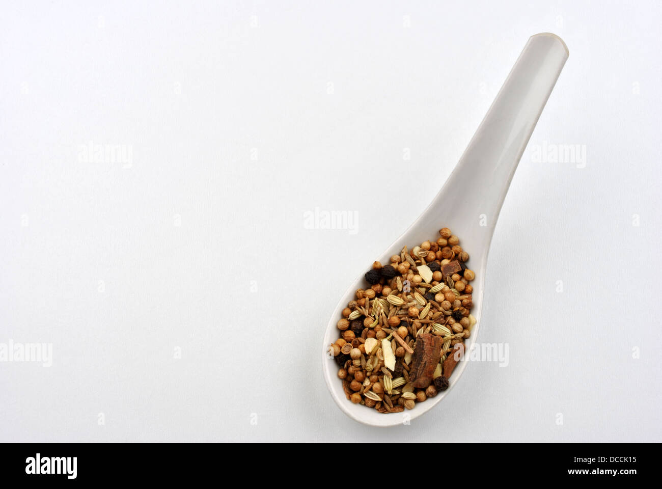 indian spice mix on a white spoon Stock Photo