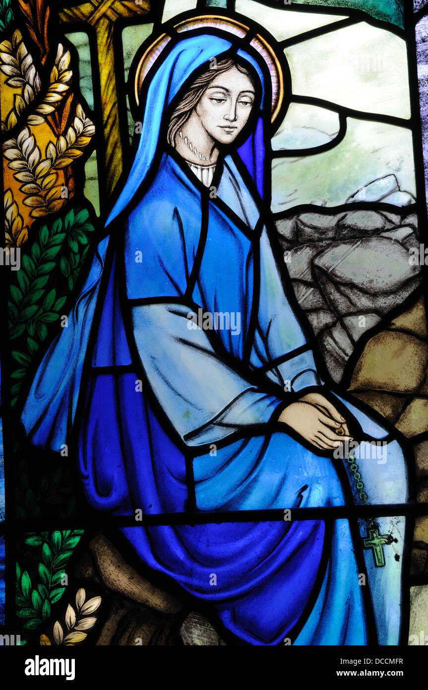 Stained glass window depicting St Winefride  at St Winefrides Well Holywell Shrine pilgrimage site Flintshire Wales Cymru UK Stock Photo