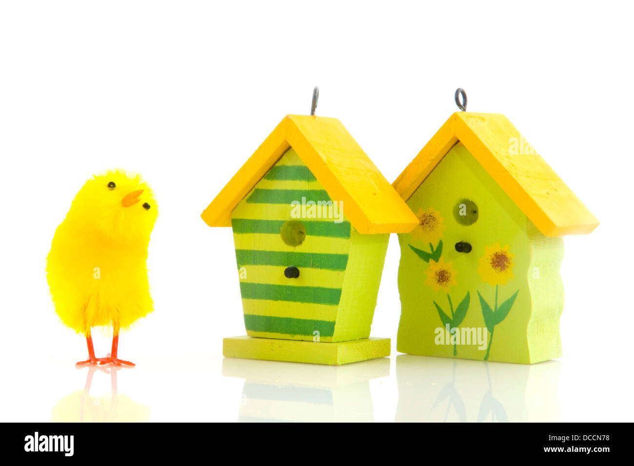 easter chicks with bird houses Stock Photo