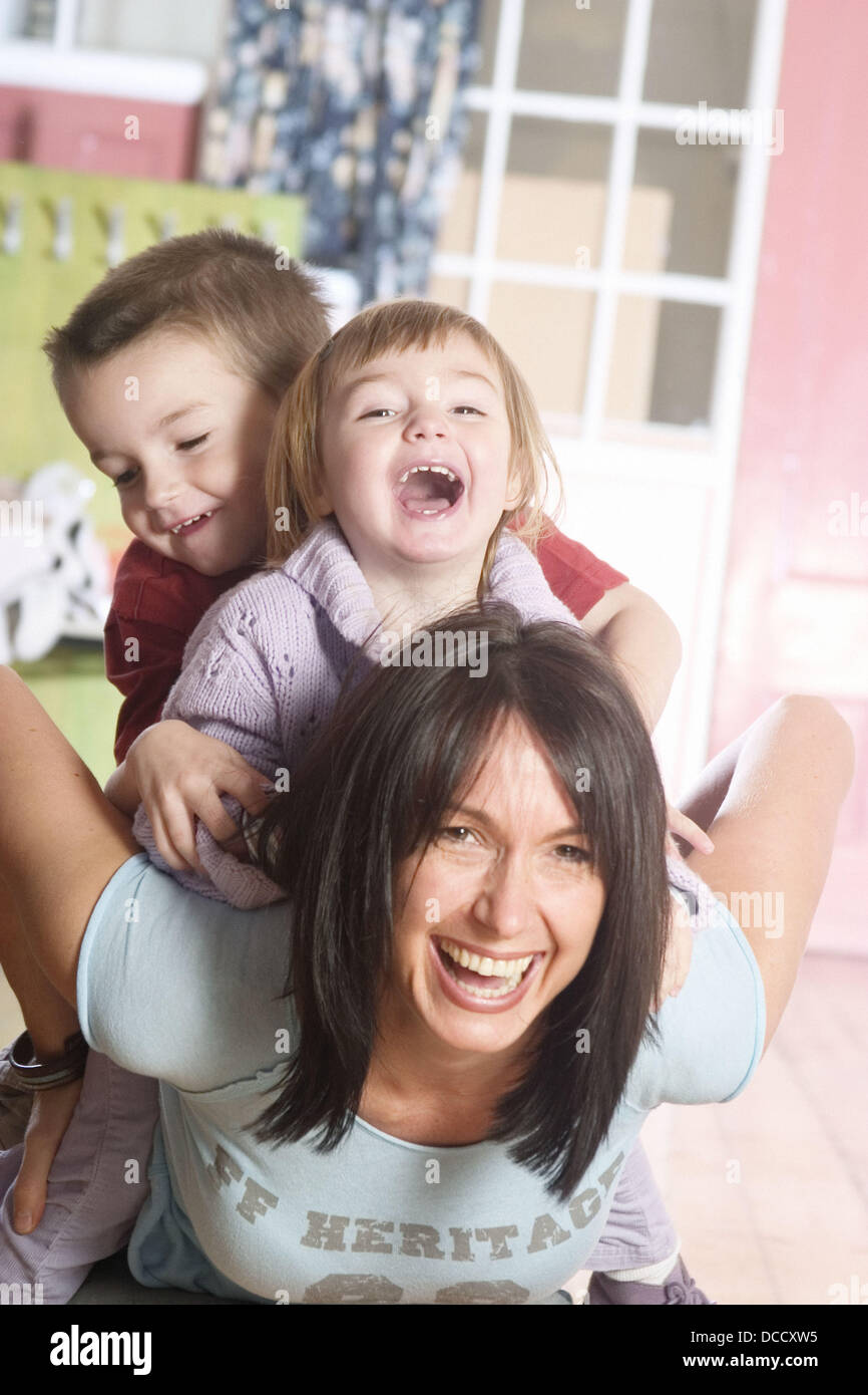 Woman Giving Little Boy Piggyback Ride Stock Photo, Picture and Royalty  Free Image. Image 10112006.