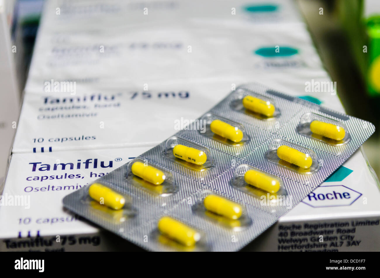 Tamiflu 30mg tablets sit on top of boxes of Tamiflu 75mg in wrapping in