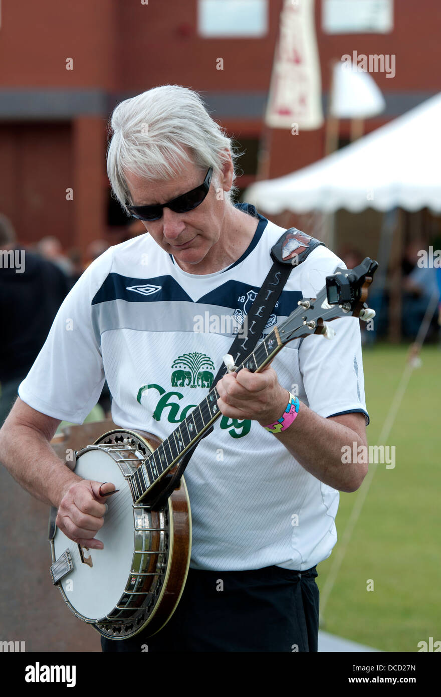 Banjo player at Warwick Folk festival, UK Stock Photo