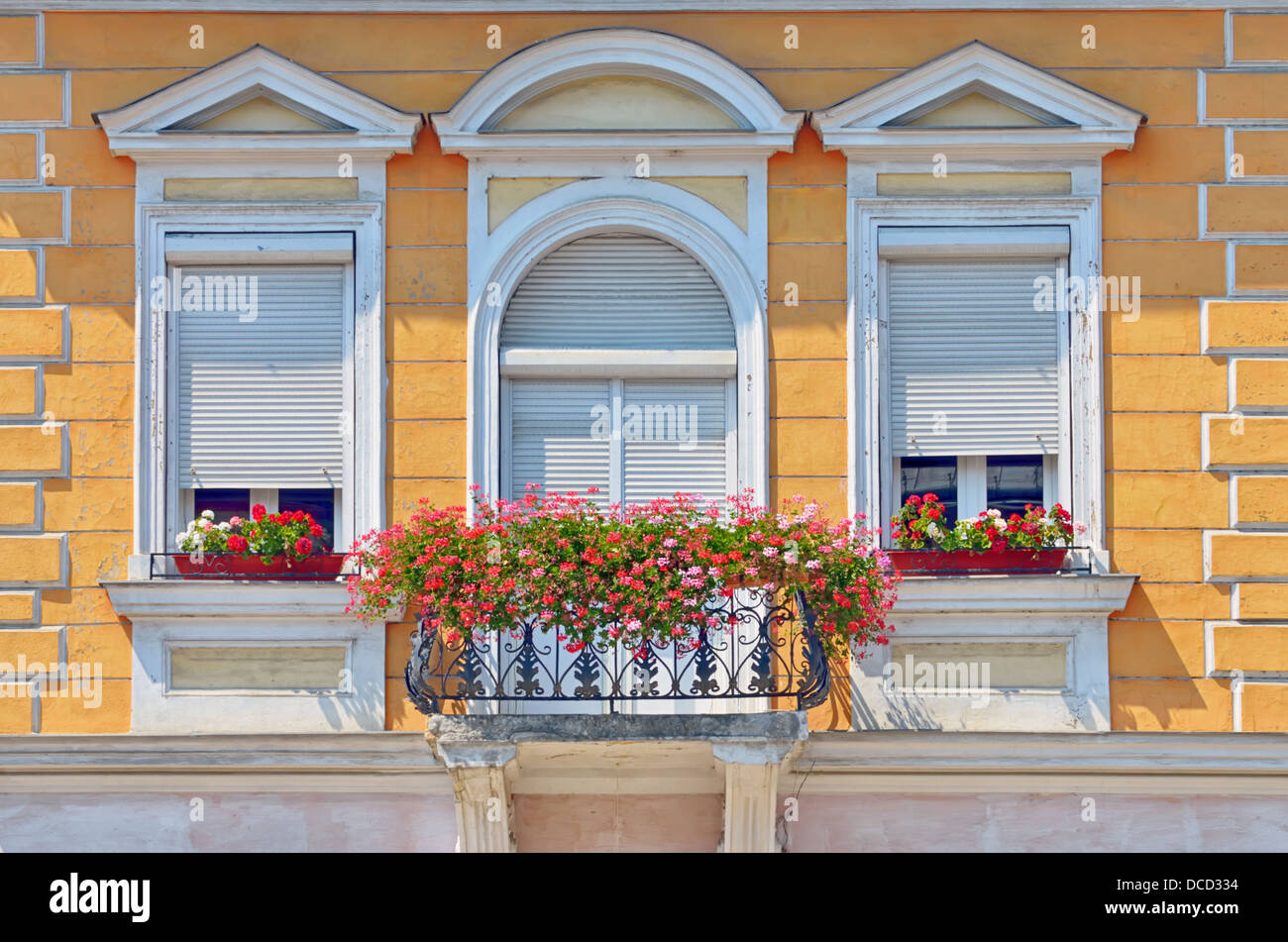 balcony with flowers pots in summer time Stock Photo