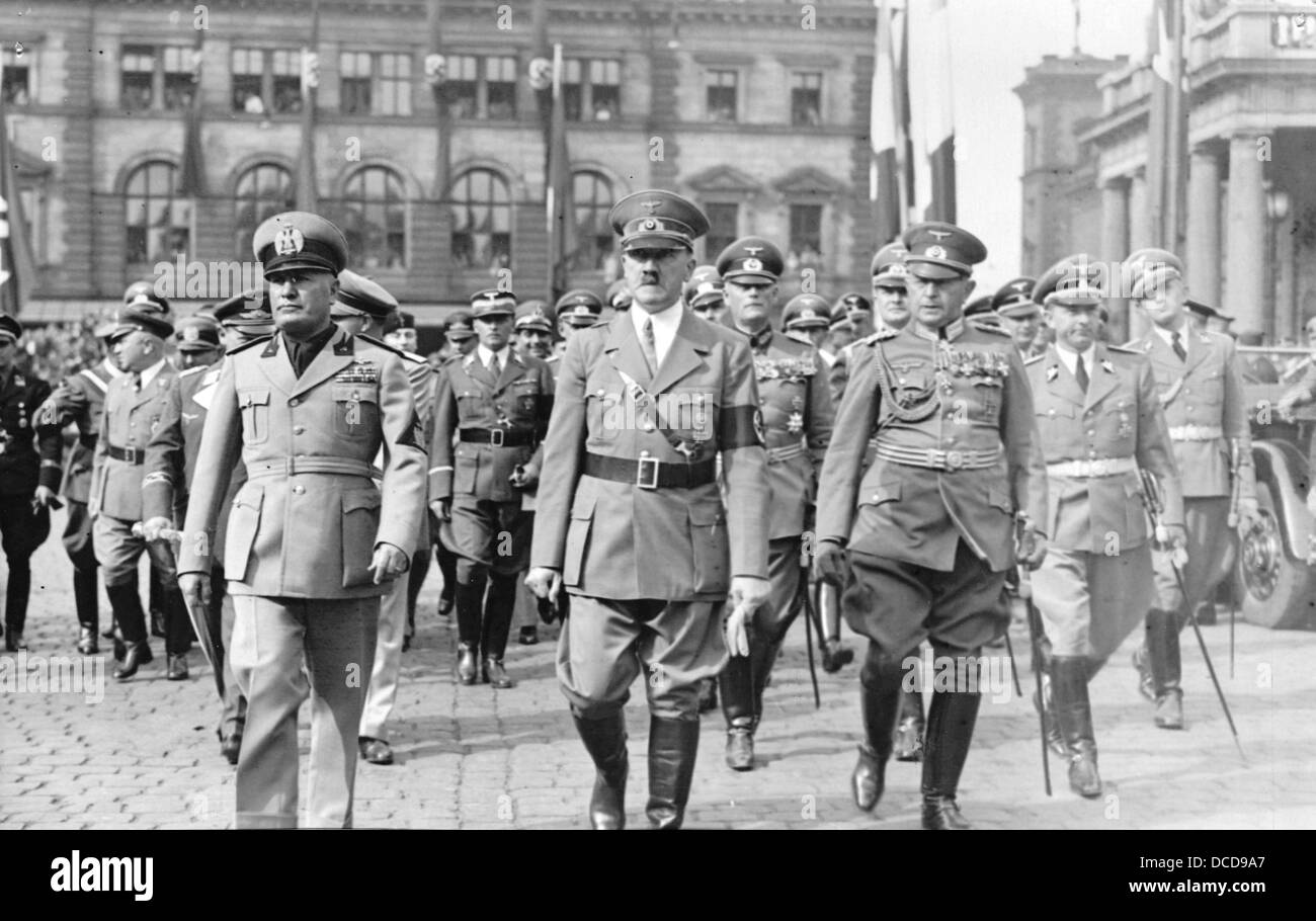 The image from the Nazi Propaganda! shows Adolf Hitler and the Italian Prime Minister Benito Mussolini after his arrival upon leaving Munich Central Station in Germany on 18 June 1940. During the meeting in Munich, both 'Führer' want to discuss the conditions of the French capitulation. Behind Mussolini, Göring und Galeazzo Ciano are pictured. To the right behind Hitler: Wilhelm Keitel. Photo: Berliner Verlag/Archiv Stock Photo