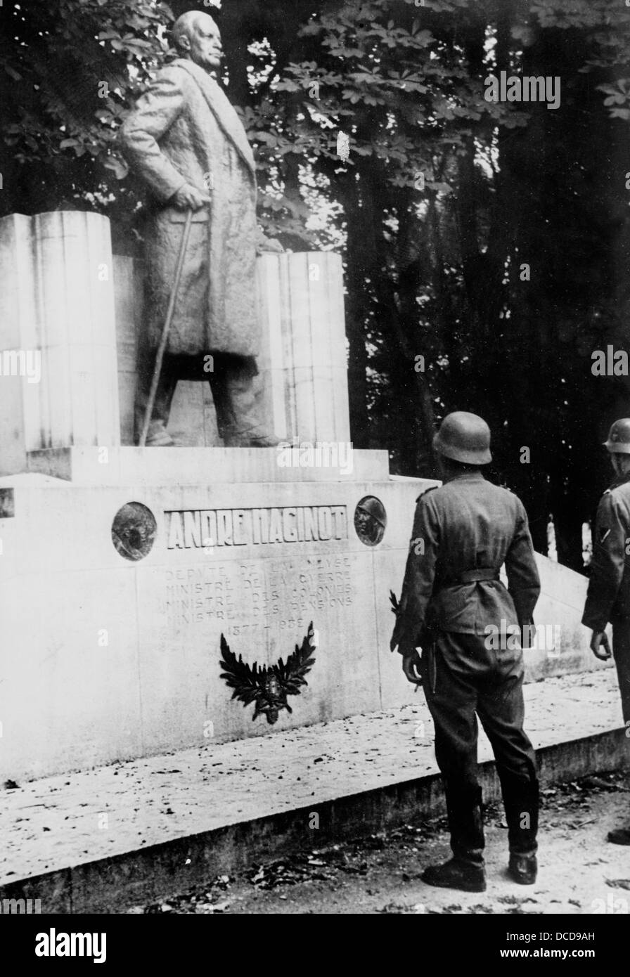 Members of the German Wehrmacht are pictured in front of the memorial for the French Minister of War André Maginot after who the French fortifications on the German-French border - the so-called Maginot Line - were named in Revigny-sur-Ornain, France, in June 1940. Fotoarchiv für Zeitgeschichte Stock Photo