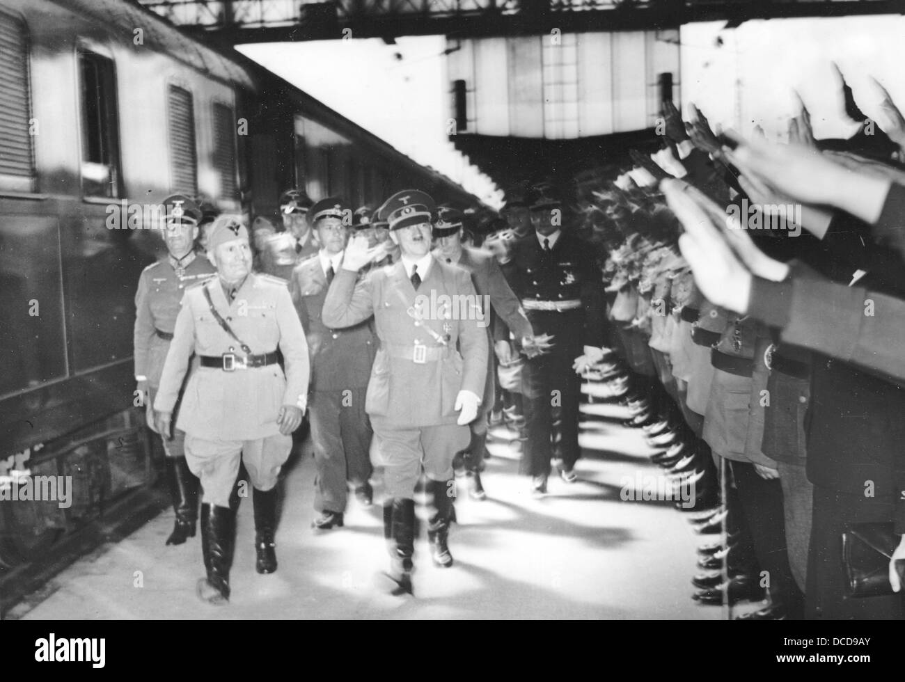 The image from the Nazi Propaganda! shows Adolf Hitler and the Italian Prime Minister Benito Mussolini upon his arrival at Munich Central Station in Germany on 18 June 1940. During the meeting in Munich, both 'Führer' want to discuss the conditions of the French capitulation. Photo: Berliner Verlag/Archiv Stock Photo