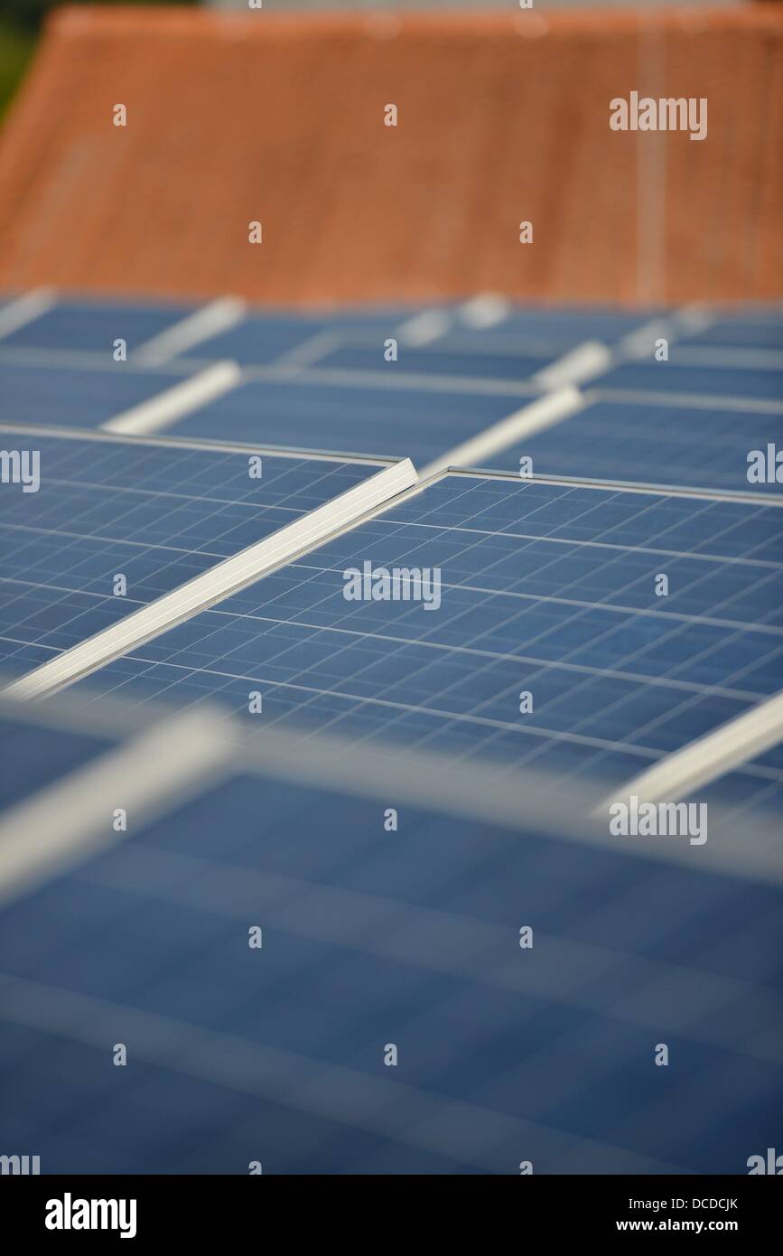 Solar panels of a solar energy plant are seen on a roof of a house in Osterode (central Germany) on 15 August 2013. Photo: Frank May Stock Photo