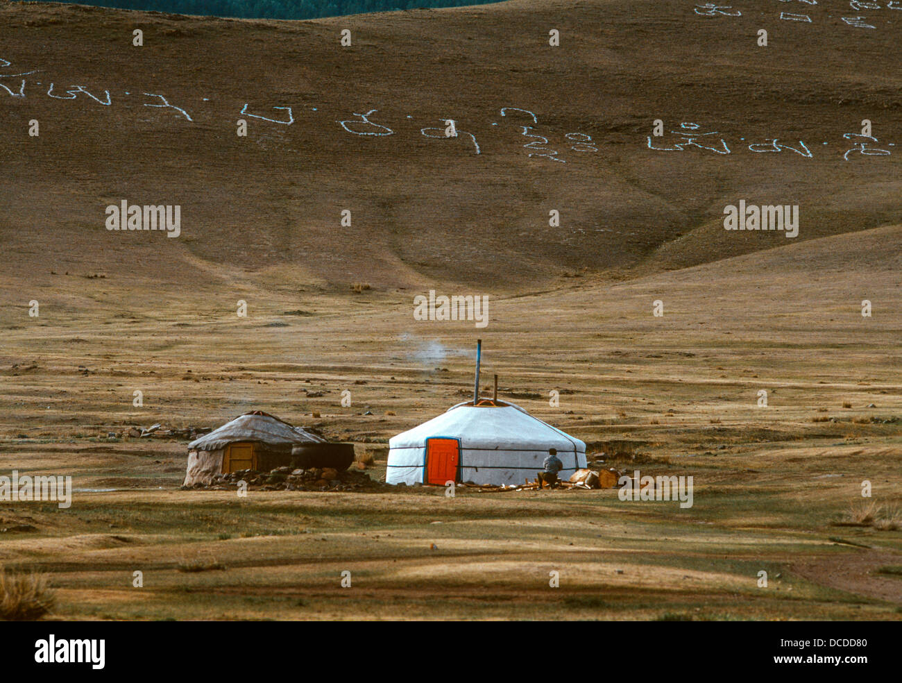 Two Mongolian ger on the Steppes with writing on hill behind Stock ...