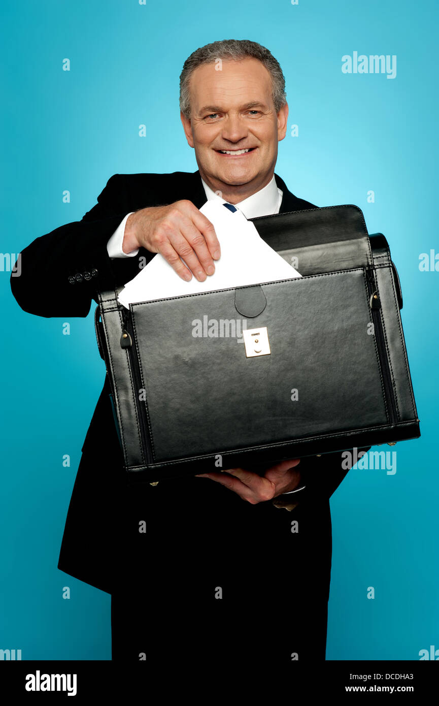 Isolated businessman keeping documents safely in a briefcase Stock ...