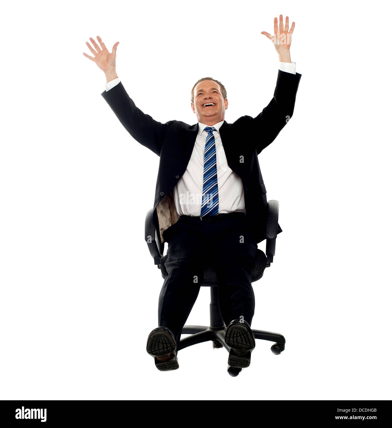 Excited businessman celebrating his success. Arms raised in air Stock ...