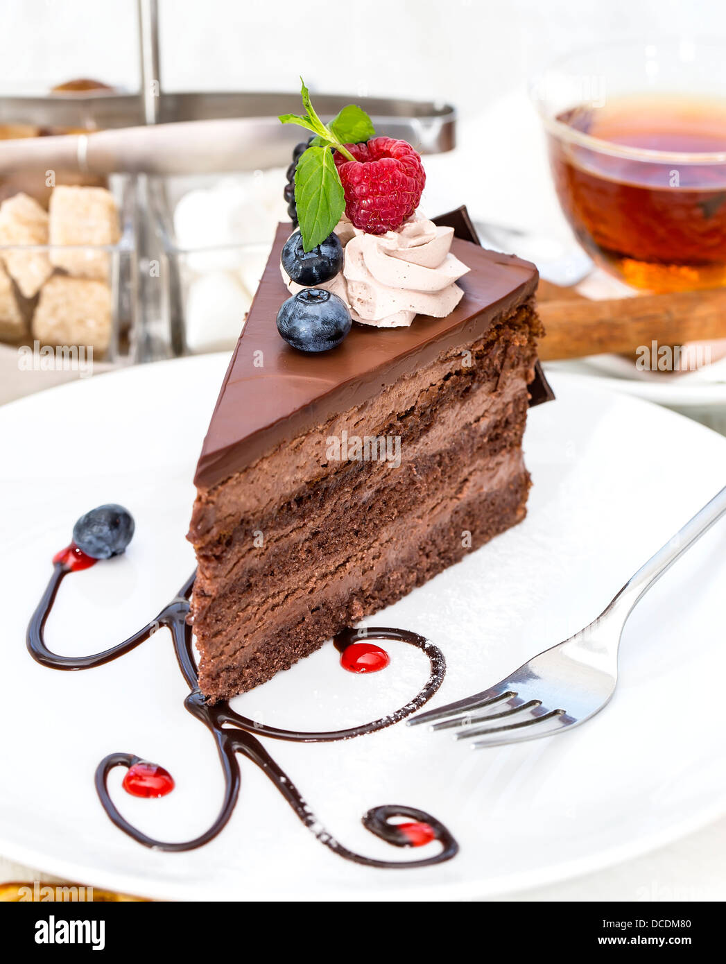 Piece of chocolate cake on a table in a restaurant Stock Photo Alamy