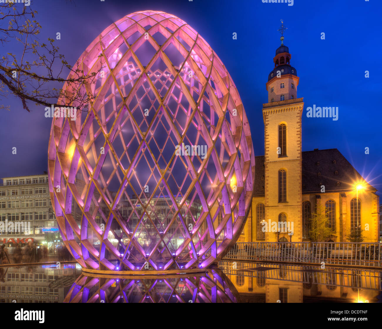 An egg lit up at night in Frankfurt, Germany. Stock Photo