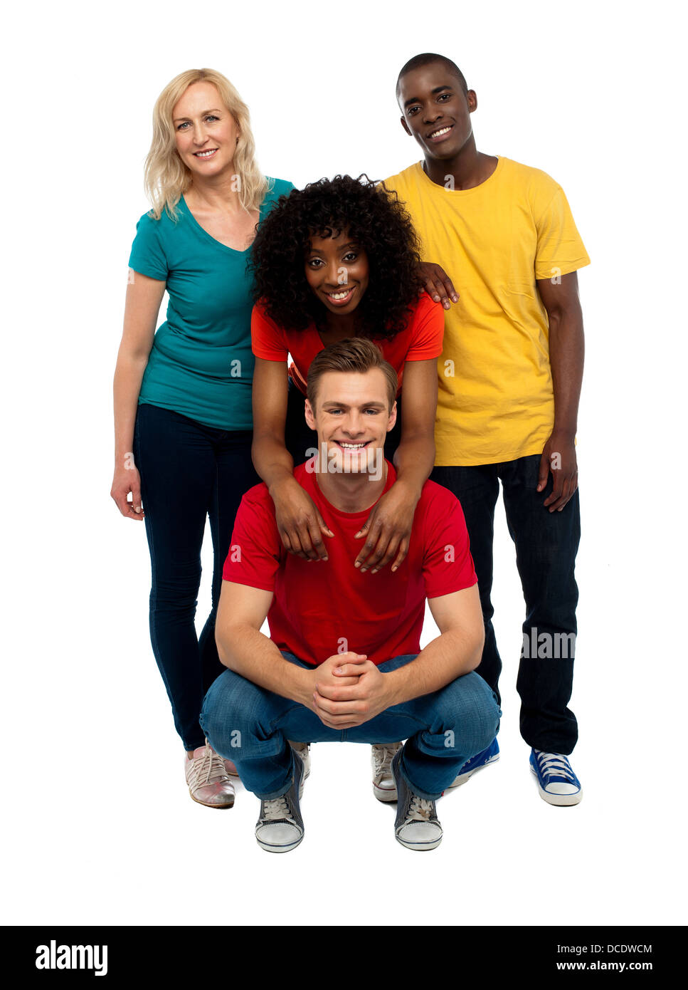 Group of four happy young people. Causal college mates posing in style Stock Photo