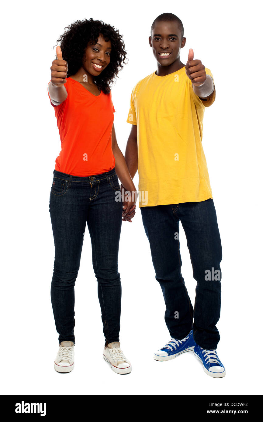 Full length portrait of happy african couple showing thumbs up Stock ...