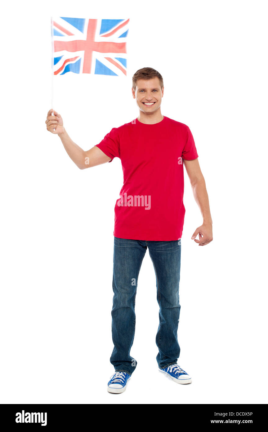 Causal guy waving United Kingdom flag isolated over white background Stock Photo
