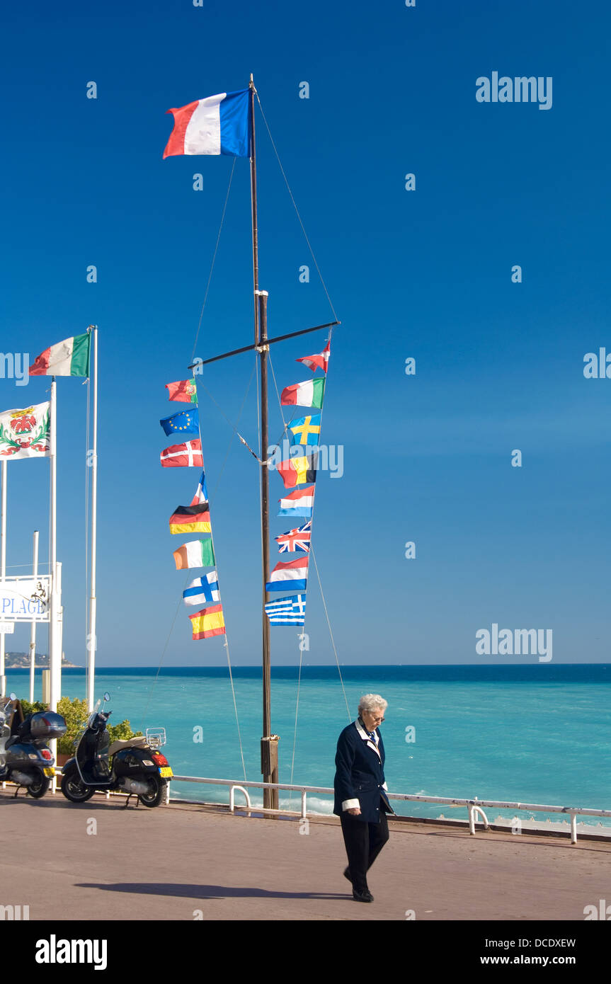 Flags of many nations against the blue sky on the Promenade des Anglais at Nice, on the Cote d'Azur, France, French Riviera Stock Photo